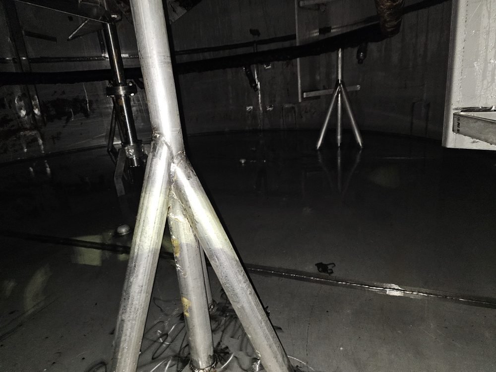 Interior of the same process tank after Enviro-Dyne hydroblasting, cleaned back to bare metal